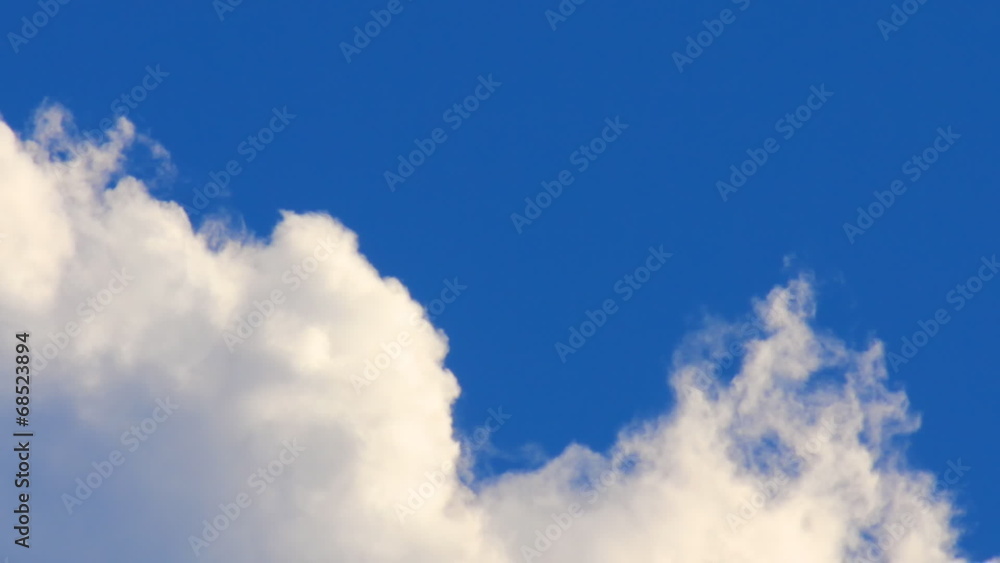swirling white clouds on a background of deep blue sky swirling white clouds on a background of deep blue sky
