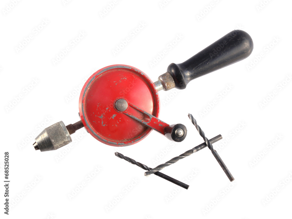 Old hand drill on a white background. Old hand drill on a white background.