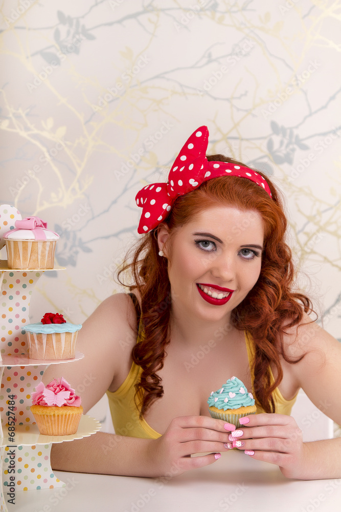 pinup redhead girl with colorful cupcakes. pinup redhead girl with colorful cupcakes.