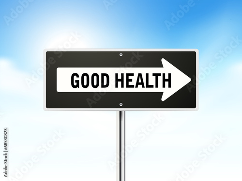 good health on black road sign
