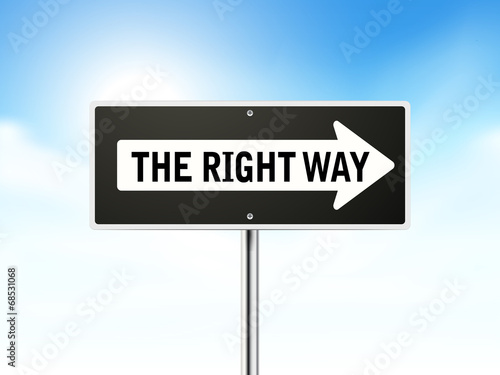the right way on black road sign