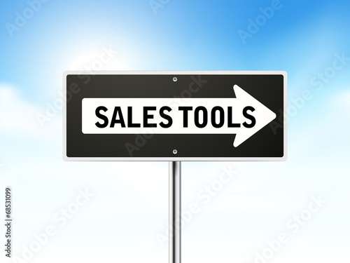 sales tools on black road sign