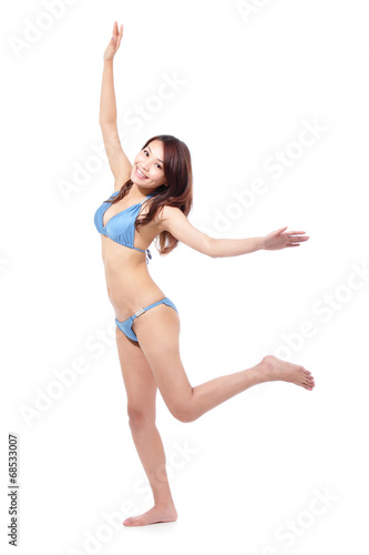 Happy young woman in sexy swimsuit