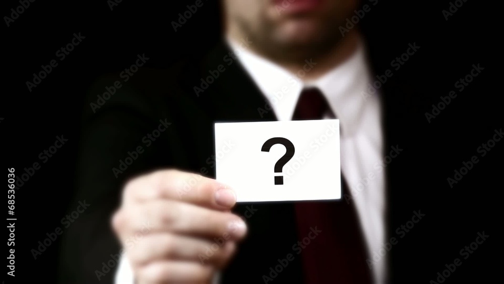 Businessman showing a card with text Businessman showing a card with text