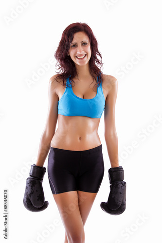 Beautiful healthy young girl with boxing gloves 