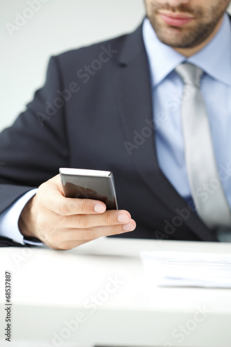 Close-up of businessman with mobile