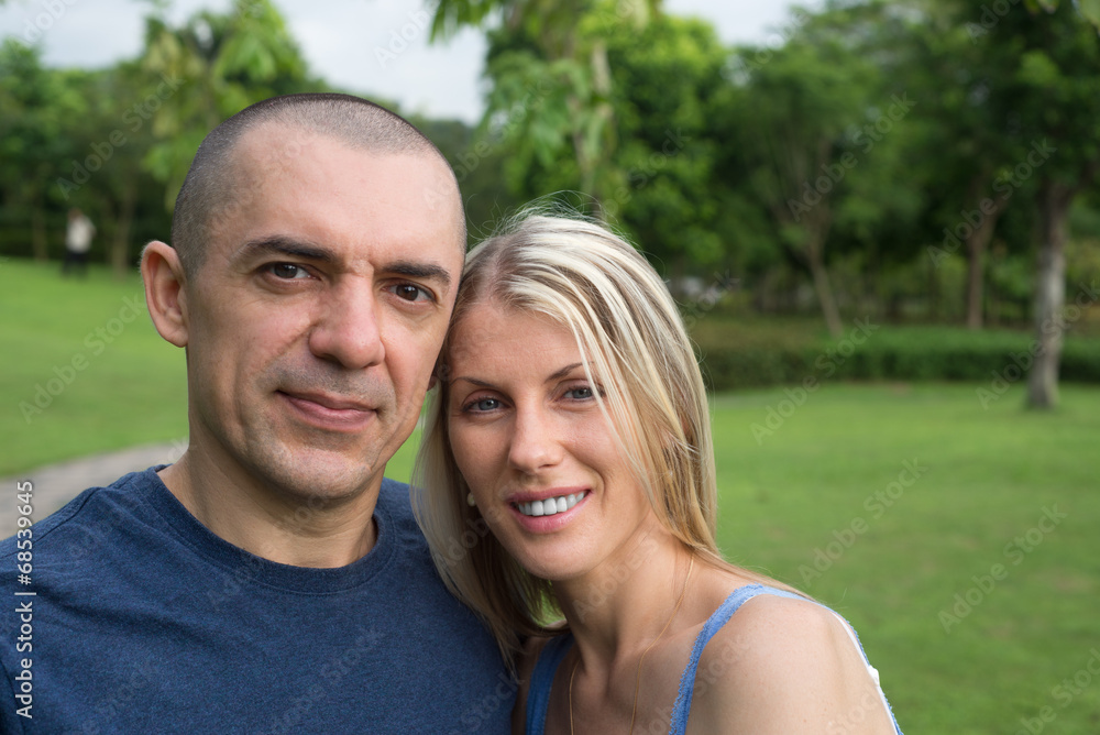 Happy in love couple in the park together Happy in love couple in the park together