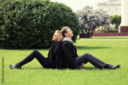 Happy young couple in a city park