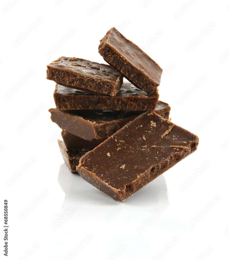 Closeup detail of chocolate parts on white background. Closeup detail of chocolate parts on white background.
