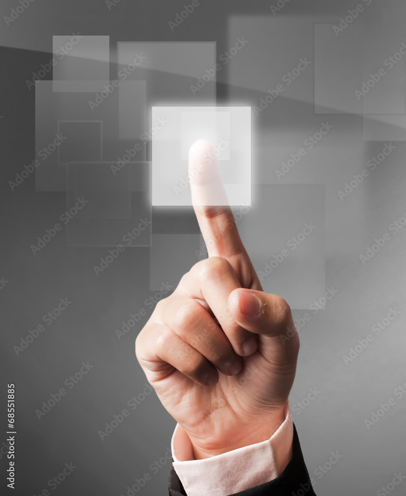 hand pushing a button on a touch screen interface hand pushing a button on a touch screen interface