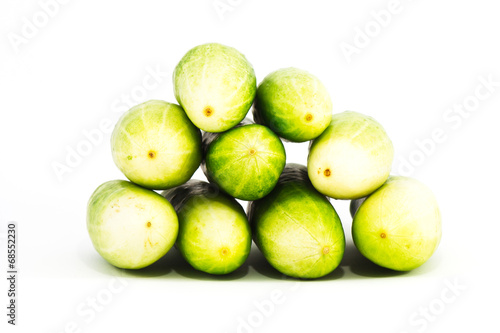 a pile of cucumber on white background
