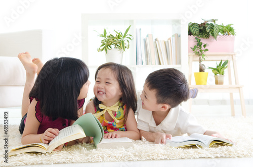 Asian kids lying on the floor