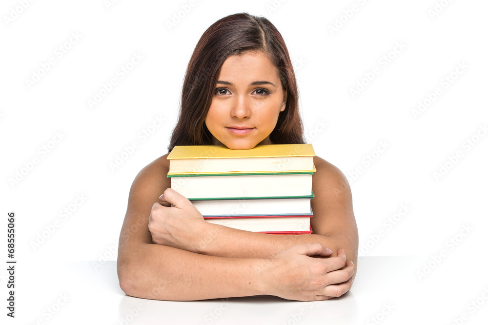picture of smiling student with stack of books. picture of smiling student with stack of books.