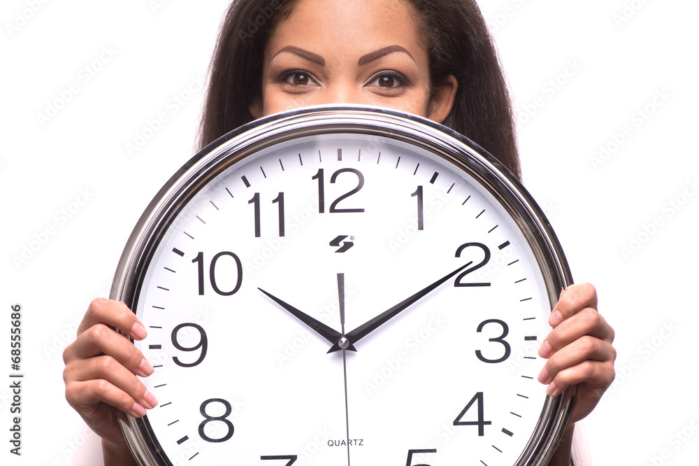 Portrait of smiling woman with clock over white background. Portrait of smiling woman with clock over white background.