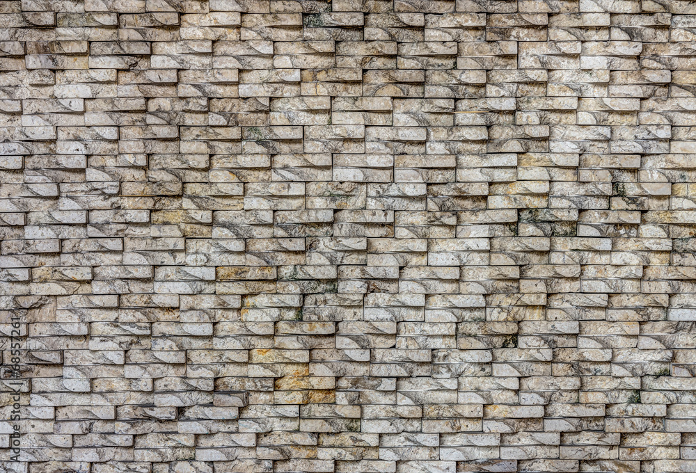 Fototapeta premium Natural stone tiles wall for background and texture