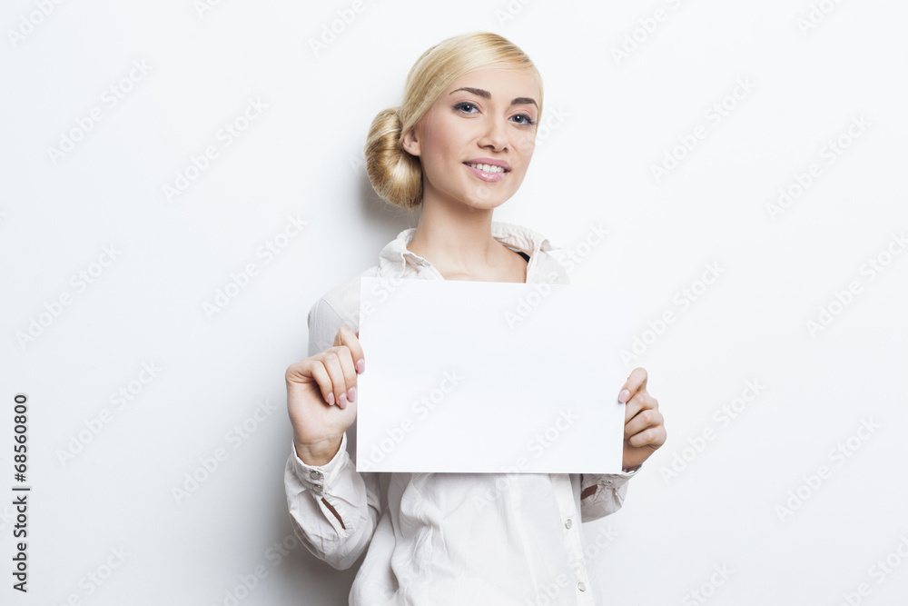 Beautiful blonde business woman holding blank paper Beautiful blonde business woman holding blank paper