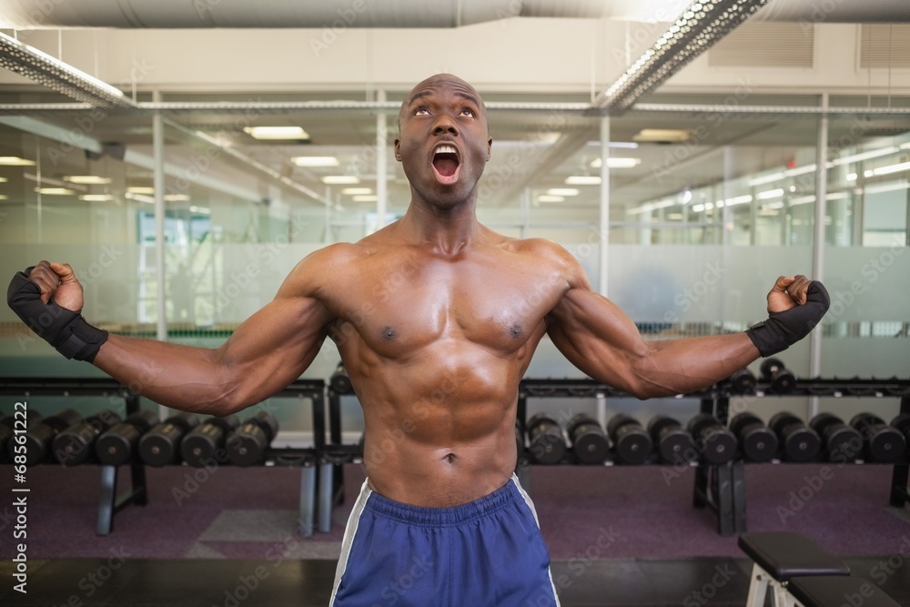 Muscular boxer shouting in health club Muscular boxer shouting in health club