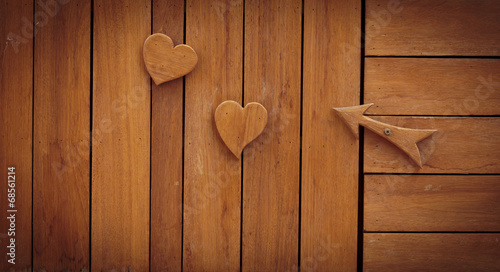 wood haert on wooden background photo