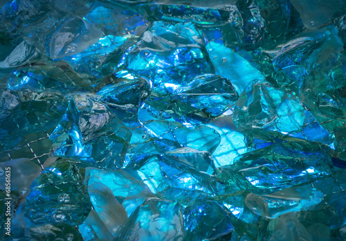 Turquoise background of shiny-crystal stones lit mysterious glow