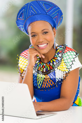 young african woman using laptop