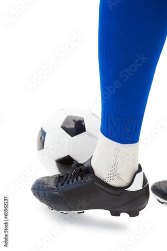 Football players foot with ball