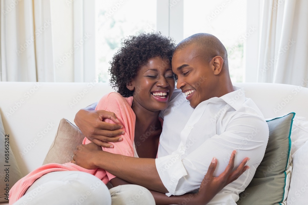 Happy couple relaxing on the couch Happy couple relaxing on the couch
