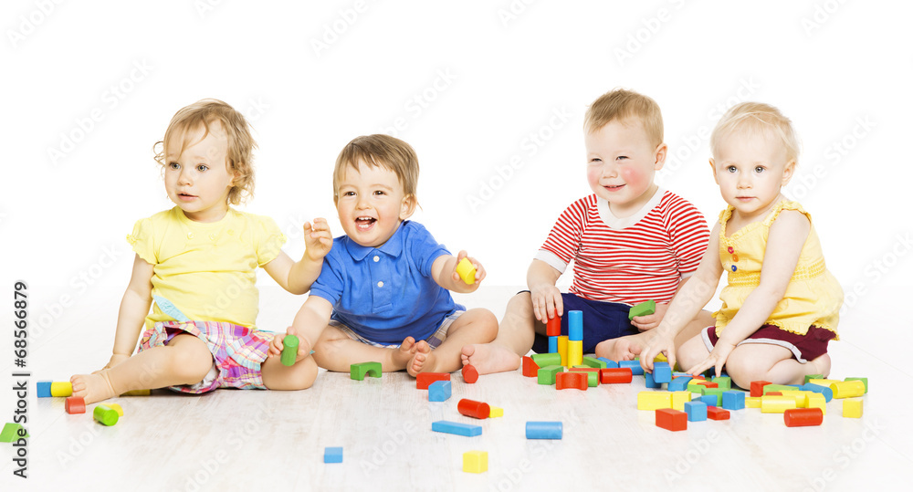 Children playing toy blocks. Baby Kids isolated white background Children playing toy blocks. Baby Kids isolated white background