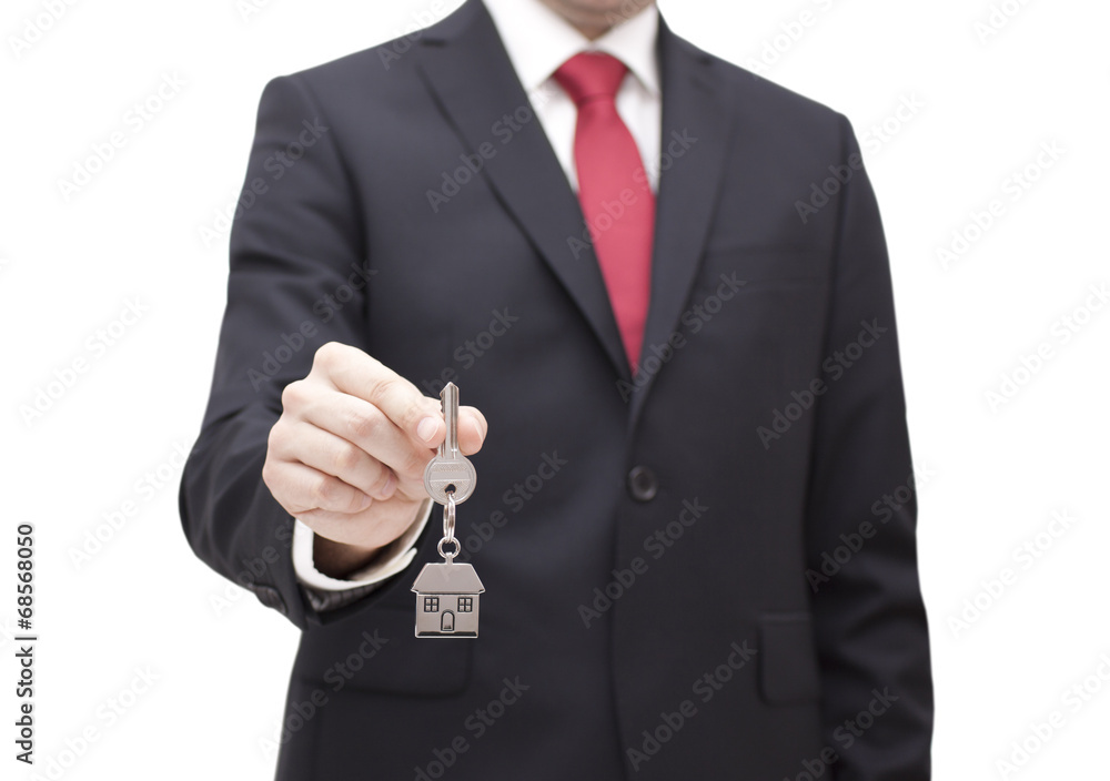 House key in businessman hand with clipping path House key in businessman hand with clipping path