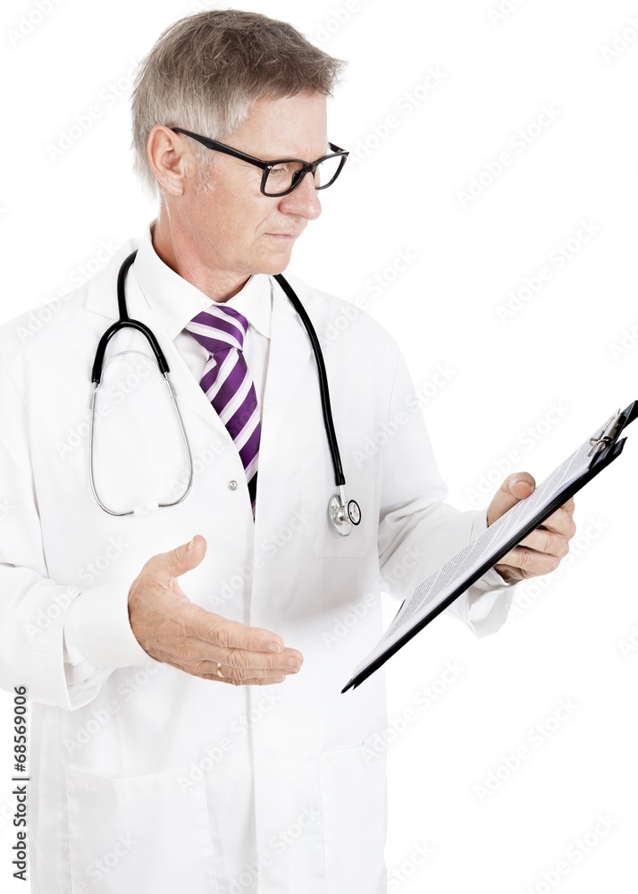 Male Doctor Seriously Reading Medical Records Male Doctor Seriously Reading Medical Records