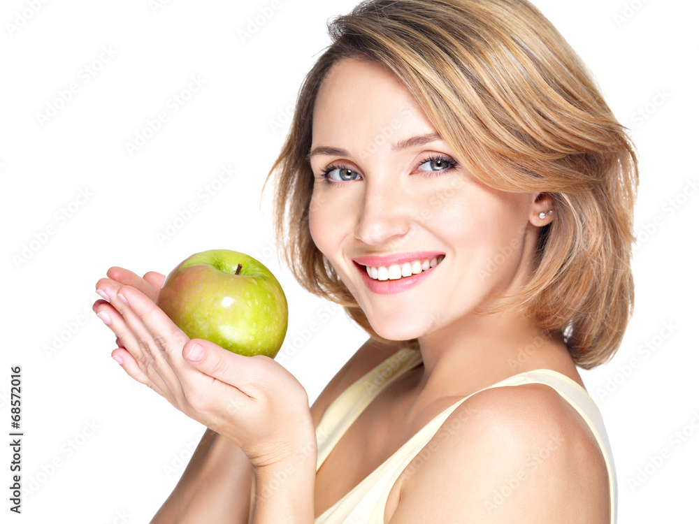 Young happy smiling woman with green apple. Young happy smiling woman with green apple.