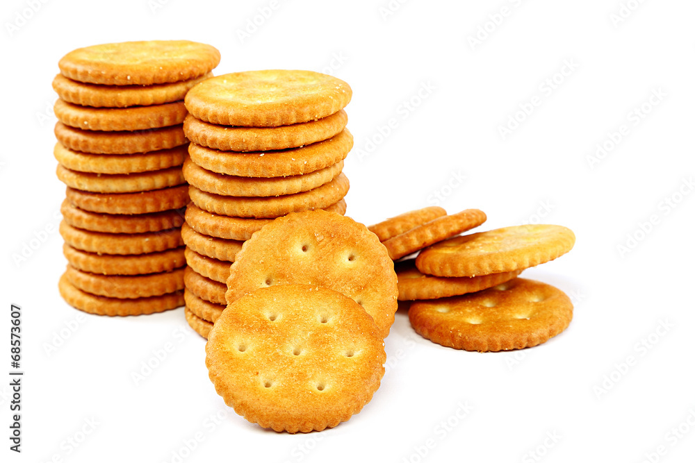 Stack of cracker biscuits on a white background. Stack of cracker biscuits on a white background.
