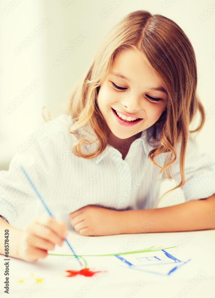 little girl painting at school little girl painting at school