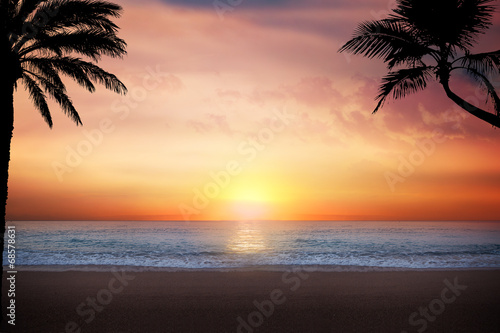 Scenic View Of Beach At Sunset