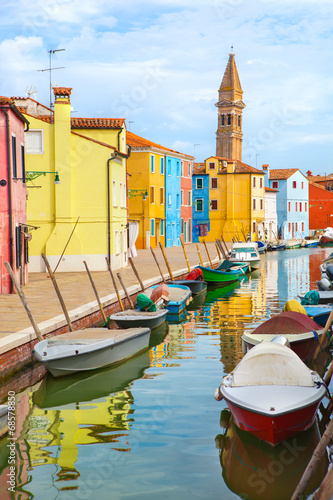 Color houses with boats on Burano island near Venice