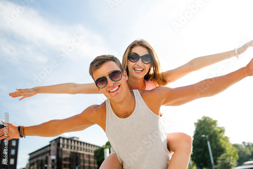 smiling couple having fun in city