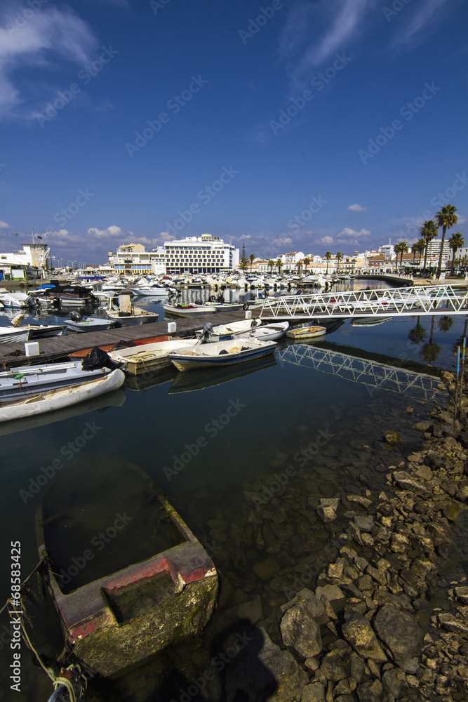 View of a beautiful marina with boats in Faro, Portugal.