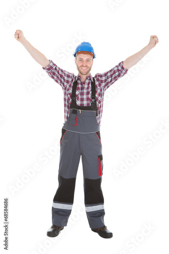 Manual Worker Screaming With Hands Raised