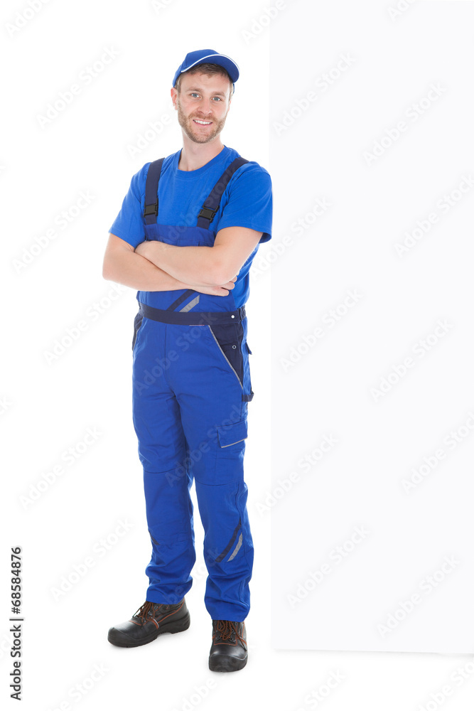 Worker Standing Arms Crossed While Leaning Over White Background Worker Standing Arms Crossed While Leaning Over White Background