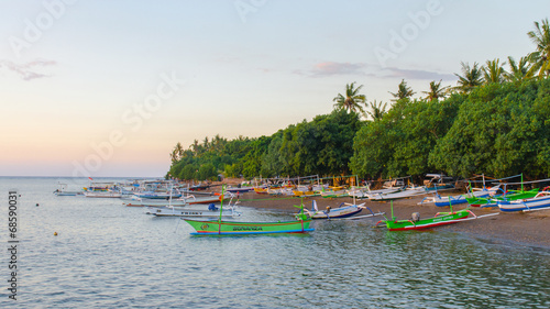 Balinese boats on the shore of Kalibukbuk Lovina photo