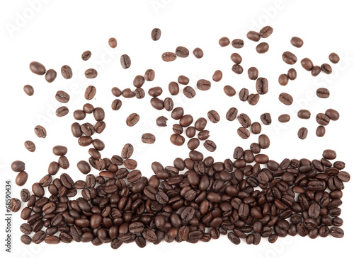 Closeup of coffee beans with focus on one