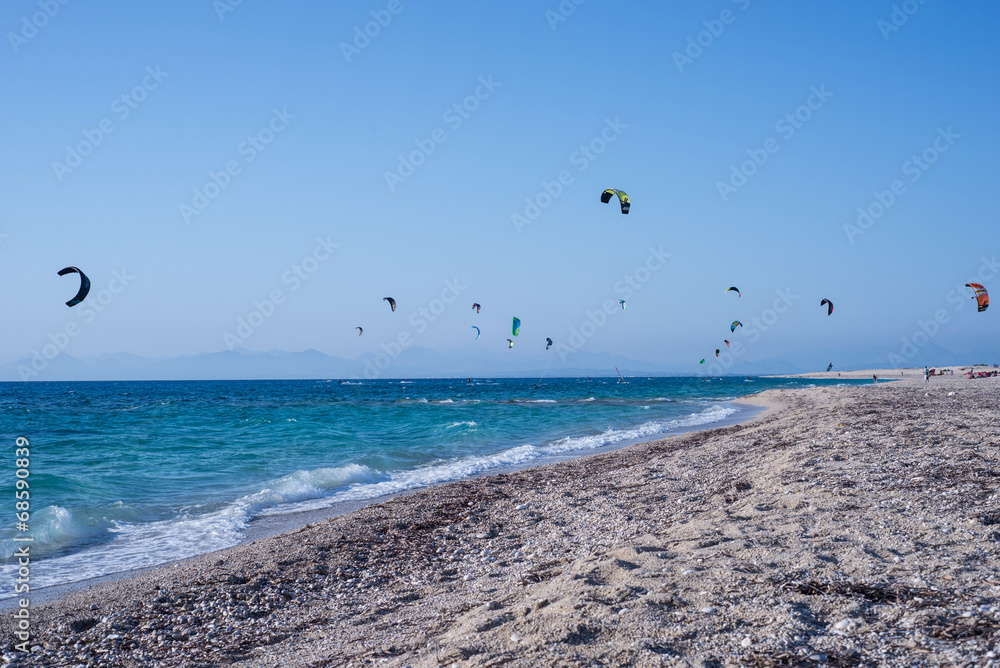 Kitesurfers on the beach in Greece