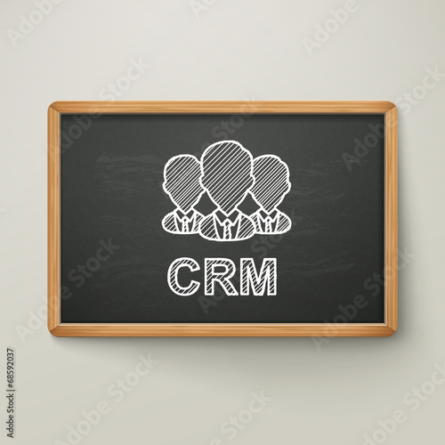 customer relationship management on blackboard in wooden frame