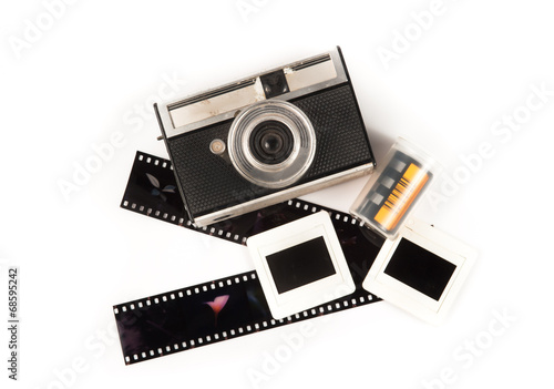 old camera and blank film strip on White background