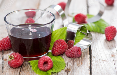 Fotografie Raspberry Sirup in a glass