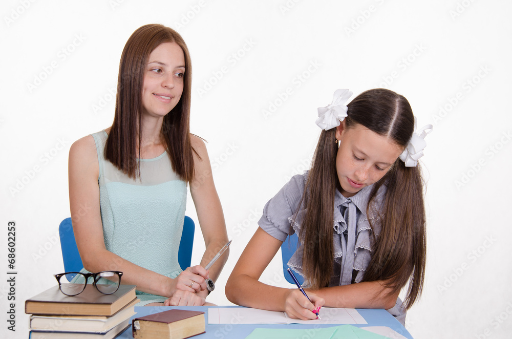 Teacher looks positively on the student girl Teacher looks positively on the student girl