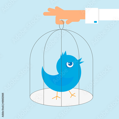 Human hand holds a cage with blue angry bird