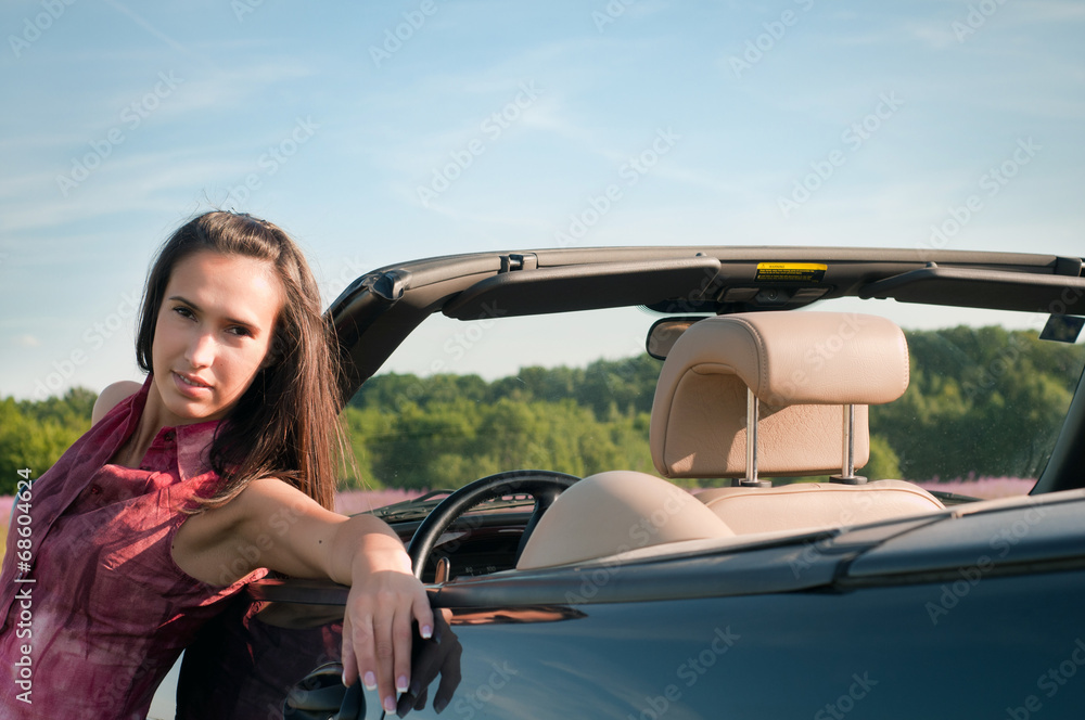 Young woman recline on the car