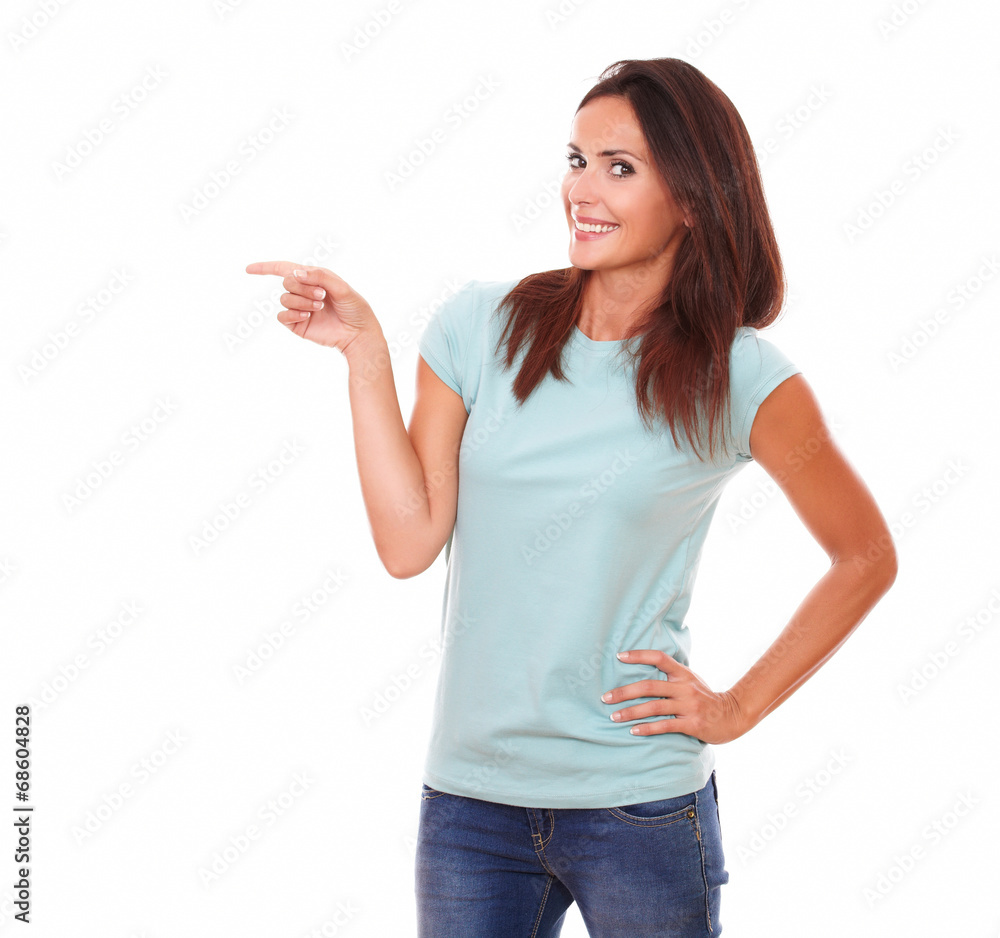 Pretty adult woman pointing to her right Pretty adult woman pointing to her right