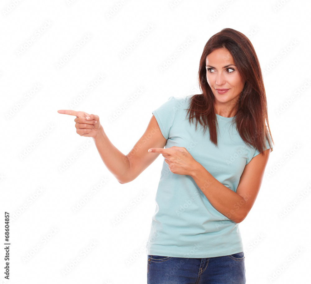 Sexy hispanic lady pointing to her right Sexy hispanic lady pointing to her right
