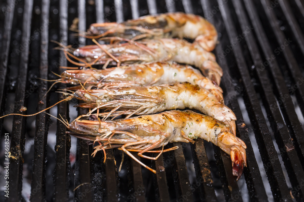 cooking shrimp kebabs on the grill